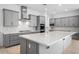 Bright kitchen featuring a large island, stainless steel appliances, and modern cabinetry at 8324 W Palo Verde Dr, Glendale, AZ 85305