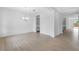 Open living room with hard flooring, a chandelier, and easy access to the kitchen and other living spaces at 8324 W Palo Verde Dr, Glendale, AZ 85305