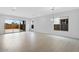 Bright, spacious living room with tile flooring and a sliding glass door to the backyard at 8324 W Palo Verde Dr, Glendale, AZ 85305
