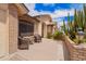 Inviting front porch with brick accents and comfortable seating, perfect for relaxing outdoors at 8336 E Neville Ave, Mesa, AZ 85209