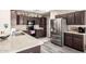 Modern kitchen with granite counters, stainless steel appliances, and ample cabinet space for storage at 8336 E Neville Ave, Mesa, AZ 85209