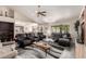 Open living area with hardwood floors, vaulted ceilings, comfortable furniture, and plenty of natural light at 8336 E Neville Ave, Mesa, AZ 85209
