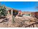Picturesque backyard featuring a pool, patio, outdoor kitchen, and xeriscaping, blending relaxation with natural beauty at 8377 S Mountain Air Ln, Gold Canyon, AZ 85118