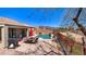 Backyard featuring a pool, patio dining set, desert plants, and mountain views at 8377 S Mountain Air Ln, Gold Canyon, AZ 85118