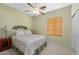 Cozy bedroom with neutral carpet, a ceiling fan, and a decorative headboard, offering a relaxing retreat at 8377 S Mountain Air Ln, Gold Canyon, AZ 85118