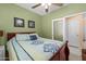Bedroom featuring neutral carpet, fan, and ensuite access at 8377 S Mountain Air Ln, Gold Canyon, AZ 85118