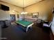Well-appointed game room featuring a billiards table, comfortable seating, and ample space for entertainment at 8377 S Mountain Air Ln, Gold Canyon, AZ 85118
