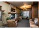 Cozy resident lounge area with a fireplace, comfortable seating, and stylish decor at 8377 S Mountain Air Ln, Gold Canyon, AZ 85118