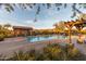 Resort-style community pool with pergola, poolside seating, and mountain views at 8377 S Mountain Air Ln, Gold Canyon, AZ 85118