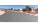 A street view showcases lush desert landscaping and houses with multiple car garages at 8377 S Mountain Air Ln, Gold Canyon, AZ 85118