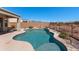 Private swimming pool surrounded by a patio and desert landscaping, perfect for leisure and enjoying the sunny weather at 8377 S Mountain Air Ln, Gold Canyon, AZ 85118