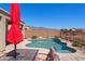 Refreshing swimming pool with a lounge area and lush landscaping, offering a serene outdoor retreat at 8377 S Mountain Air Ln, Gold Canyon, AZ 85118