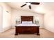 Bright bedroom features a large bed with beautiful headboard, and window shutters at 9728 E Pantera Ave, Mesa, AZ 85212