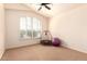 Bright bedroom with vaulted ceiling, neutral carpet, and adjustable window shutters at 9728 E Pantera Ave, Mesa, AZ 85212