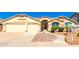 Inviting, single-story home with a two-car garage and desert landscaping under a clear blue sky at 9728 E Pantera Ave, Mesa, AZ 85212