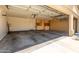 Spacious garage with built-in storage cabinets and ample room for parking at 9728 E Pantera Ave, Mesa, AZ 85212
