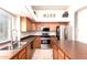 Functional kitchen with stainless steel appliances, ample counter space, and a central island at 9728 E Pantera Ave, Mesa, AZ 85212