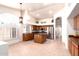 Well-lit kitchen boasts an island, stainless steel appliances, and plenty of cabinet space at 9728 E Pantera Ave, Mesa, AZ 85212