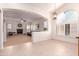 Bright living room with a fireplace and large arched window offers plenty of natural light at 9728 E Pantera Ave, Mesa, AZ 85212