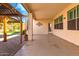 Covered patio space featuring a paved stone flooring and a built-in wooden gazebo at 9728 E Pantera Ave, Mesa, AZ 85212