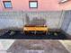 Cozy backyard planters with cinder block wall, mulch and rock accents, and dual windows above for natural light at 1017 S Lola Ln, Tempe, AZ 85281
