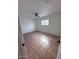 Bedroom boasts tiled flooring, ceiling fan, and a window at 1017 S Lola Ln, Tempe, AZ 85281