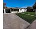 Charming single-story home with well-maintained lawn, neutral exterior, and concrete driveway at 1017 S Lola Ln, Tempe, AZ 85281