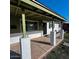 Covered front porch with decorative columns and a stylish front door at 1017 S Lola Ln, Tempe, AZ 85281