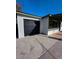 Attached garage showcasing the black garage door and concrete driveway at 1017 S Lola Ln, Tempe, AZ 85281