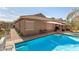 A refreshing backyard pool complemented by patio space and mature landscaping at 10932 E Bella Via --, Mesa, AZ 85212
