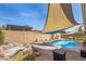 Beautiful backyard featuring a rock waterfall feature, desert landscaping, and a sparkling pool at 10932 E Bella Via --, Mesa, AZ 85212