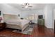 A serene bedroom features a king-size bed, neutral decor, and large windows offering a peaceful retreat at 10932 E Bella Via --, Mesa, AZ 85212
