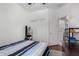 Bright bedroom featuring wood floors, a fan, and a sliding closet door for lots of storage at 10932 E Bella Via --, Mesa, AZ 85212