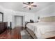 A spacious bedroom includes a cozy king-size bed, work desk, and views that provide a tranquil escape at 10932 E Bella Via --, Mesa, AZ 85212