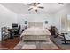A serene bedroom featuring a king-size bed, work desk, and ample space for a workout area at 10932 E Bella Via --, Mesa, AZ 85212