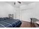 Bedroom with wood floors, a ceiling fan, and a window, providing a comfortable and functional living space at 10932 E Bella Via --, Mesa, AZ 85212