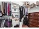 Walk-in closet offers ample storage with built-in shelving, hanging rods, and additional space for organization at 10932 E Bella Via --, Mesa, AZ 85212