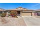 Lovely single-story home boasting a well-manicured front yard with vibrant flowering bushes and desert plants at 10932 E Bella Via --, Mesa, AZ 85212
