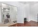 A bright hallway with hardwood and tile flooring that leads to a living area, enhancing the home's flow at 10932 E Bella Via --, Mesa, AZ 85212