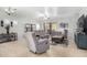 Spacious living room featuring neutral walls, tiled flooring, comfortable seating, and plenty of natural light at 10932 E Bella Via --, Mesa, AZ 85212