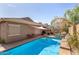 A refreshing backyard pool complemented by patio space and mature landscaping at 10932 E Bella Via --, Mesa, AZ 85212