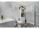 Well-lit bathroom with vanity sink, toilet, and glass shower, complemented by modern fixtures at 10951 N 91St Ave # 250, Peoria, AZ 85345