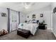 Bright bedroom with a ceiling fan, plush carpeting, and soft, stylish decor at 10951 N 91St Ave # 250, Peoria, AZ 85345