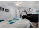 Bedroom with a view to the kitchen, carpet, and decorative wall art at 10951 N 91St Ave # 250, Peoria, AZ 85345
