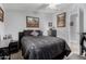 Comfortable bedroom featuring dark furniture, carpeted floors and neutral paint at 10951 N 91St Ave # 250, Peoria, AZ 85345