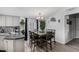 This shows a close up view of the dining table next to the eat in kitchen at 10951 N 91St Ave # 250, Peoria, AZ 85345