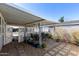 Covered patio with table and chairs, creating a relaxing outdoor living space at 10951 N 91St Ave # 250, Peoria, AZ 85345