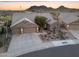 Aerial view of a desert home with mountain views and desert landscaping at 11053 E Hedgehog Pl, Scottsdale, AZ 85262