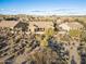 Aerial view of the home in a desert neighborhood with beautiful mountain views at 11053 E Hedgehog Pl, Scottsdale, AZ 85262