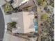 Aerial view of a luxury home showcasing the backyard oasis with a pool and fire pit at 11053 E Hedgehog Pl, Scottsdale, AZ 85262